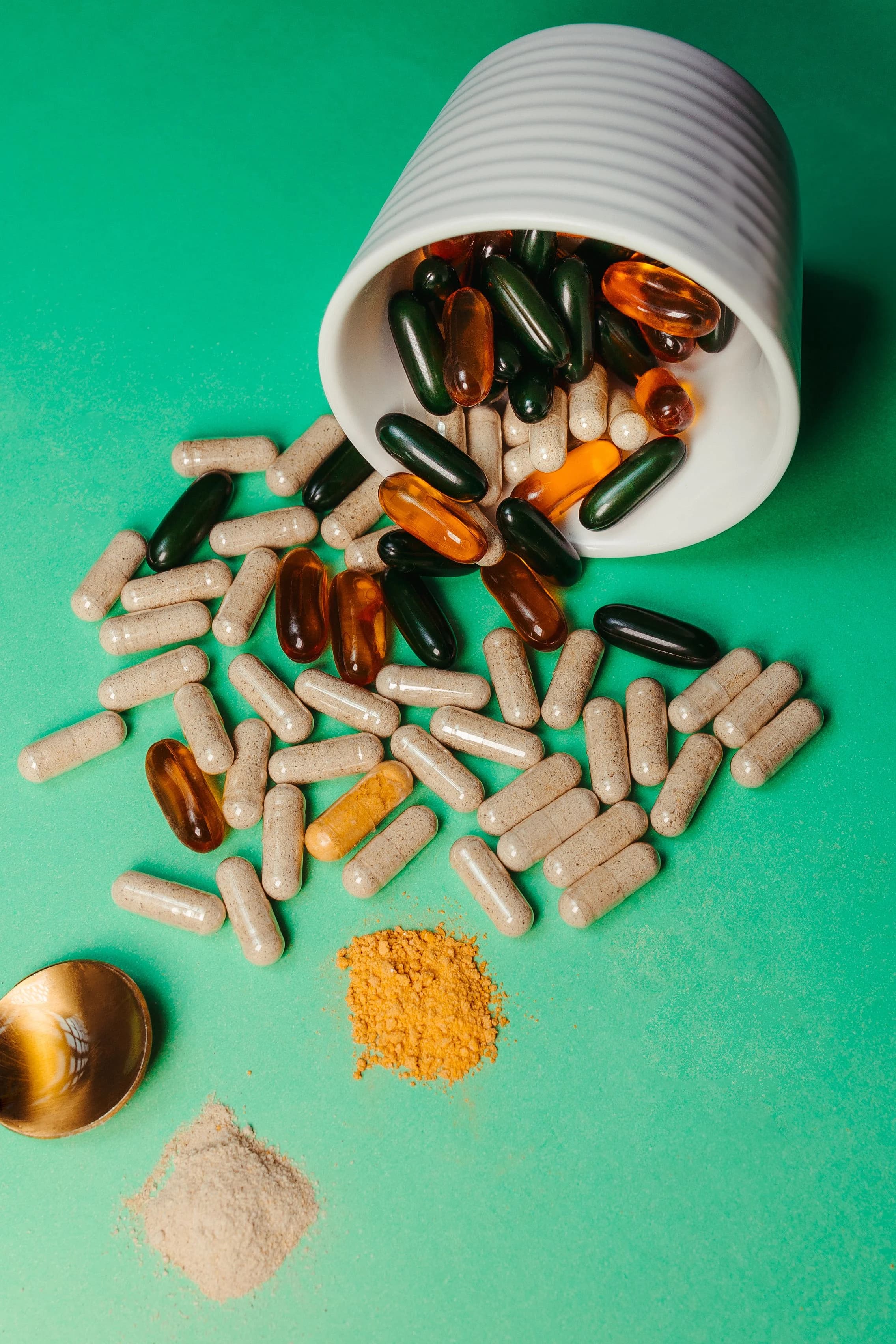 Micronutrient capsules arranged on a green surface